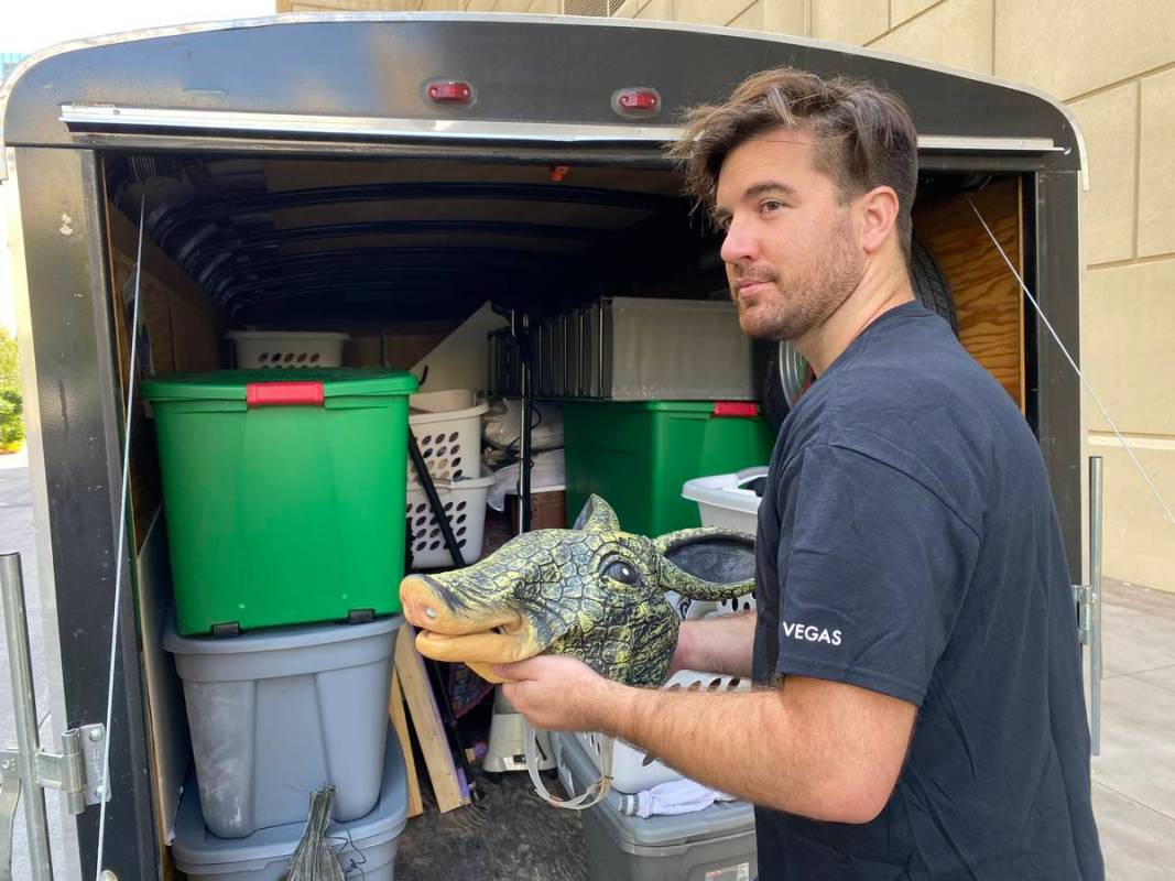 Luke Striffler, who played Ross in "Friends: A Musical Parody" is shown packing up his prop arm ...