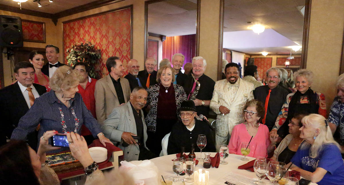 Saxophonist Don Hill, who played with The Treniers and Louis Armstrong, surrounded by friends a ...