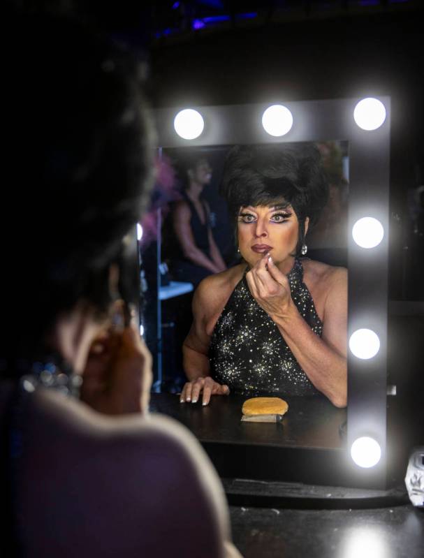 Edie puts the finishing touches on her makeup in the dressing room before another "Faaabul ...