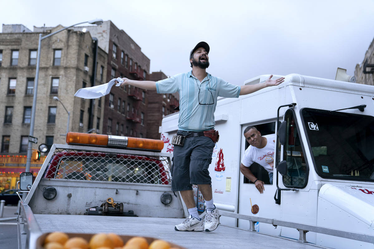 Lin-Manuel Miranda, left, portrays Mr. Piragüero and Christopher Jackson as the Mr. Softee tru ...