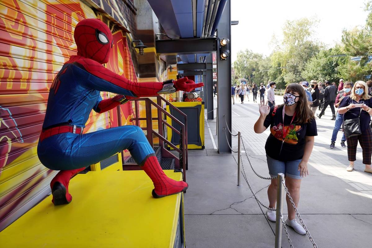 A Spider-Man character poses for guests following "The Amazing Spider-Man!" show at the Avenger ...