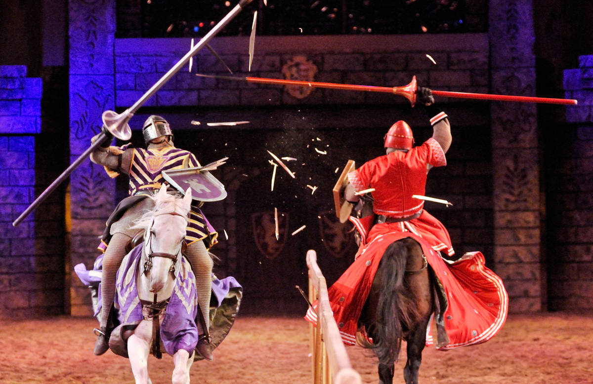 Anthony Root riding Osiris, left, battles Chris Warren riding Cubby, during a jousting demonstr ...