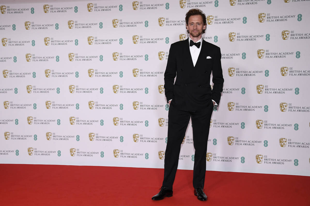 Actor Tom Hiddleston poses for photographers upon arrival at the Bafta Film Awards, in central ...