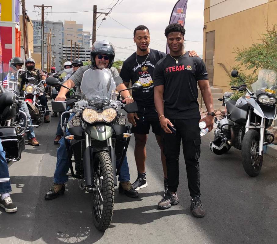 Rick Harrison, free-agent QB Brett Hundley, and Kenyan Drake of the Las Vegas Raiders are shown ...