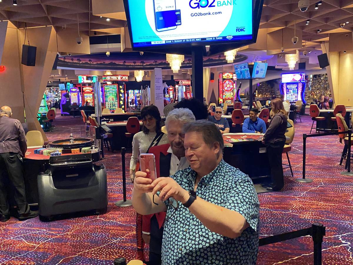 Virgin Group founder Richard Branson is shown with a casino guest at Virgin Hotels Las Vegas on ...