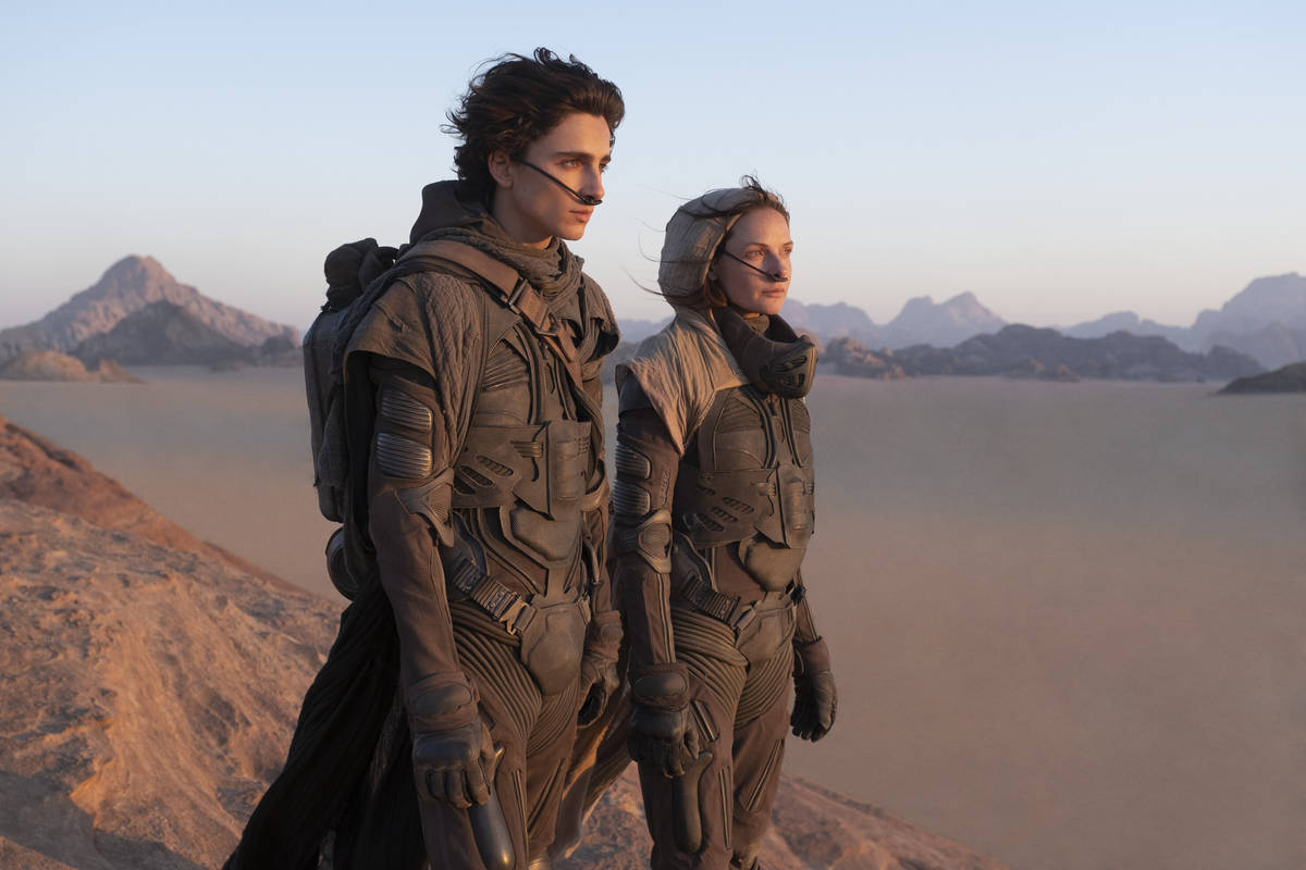TIMOTHÉE CHALAMET as Paul Atreides and REBECCA FERGUSON as Lady Jessica Atreides in "Dune." (C ...