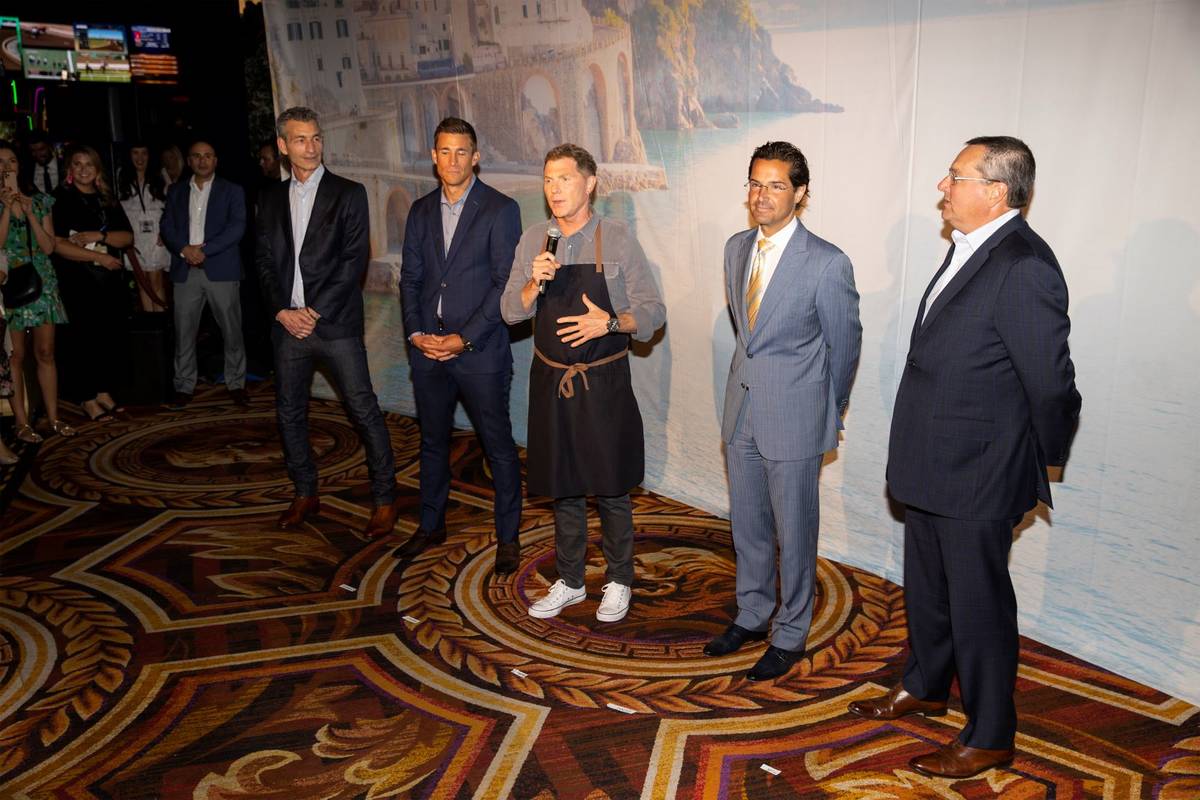 Celebrity chef Bobby Flay, center, with Laurence Kretchmer, from left, managing partner at Bobb ...