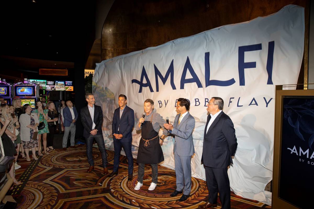 Celebrity chef Bobby Flay, center, with Laurence Kretchmer, from left, managing partner at Bobb ...