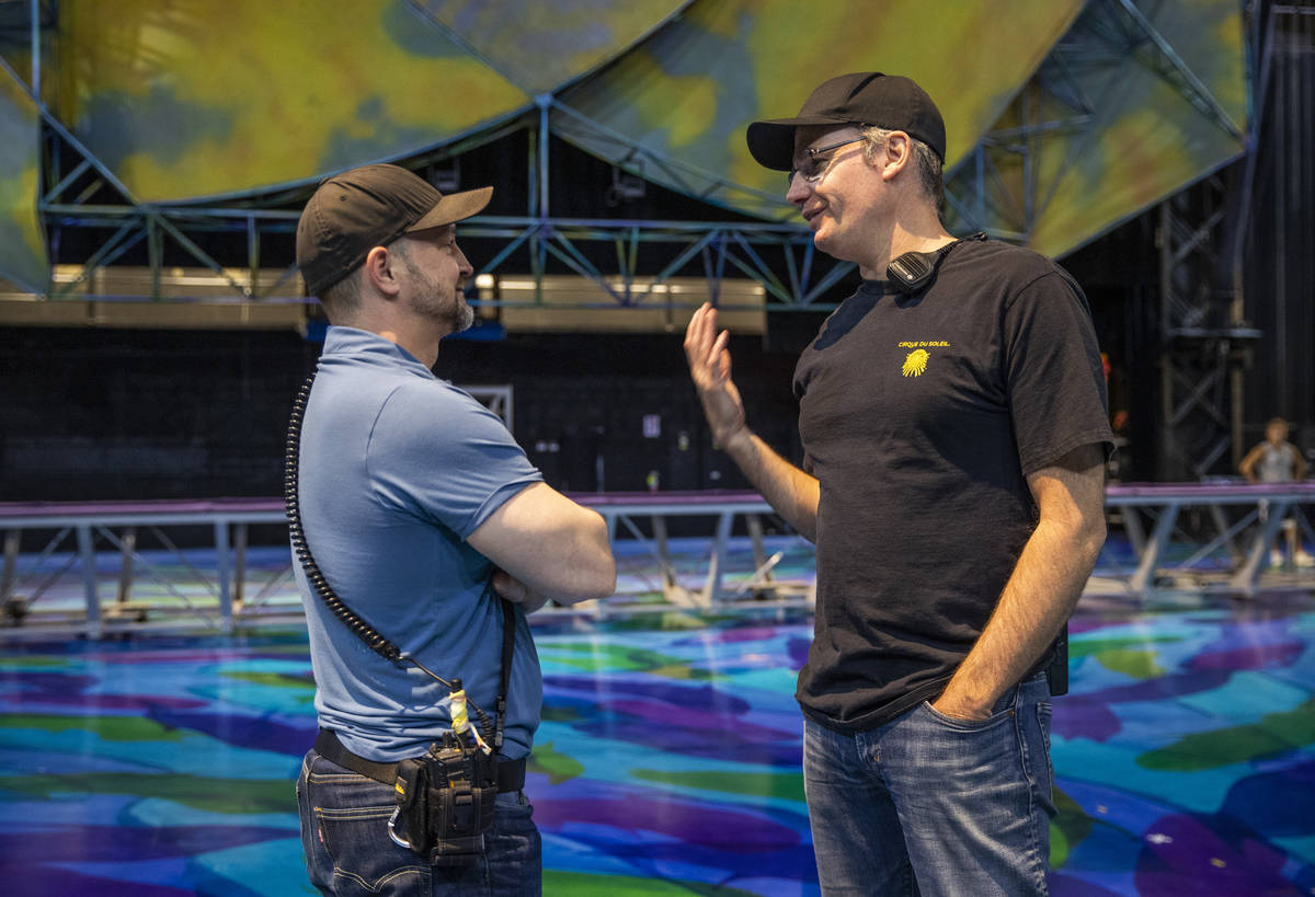 Head coach Paul Cameron, right, talks with coach All-star Booth during a rehearsal of several a ...
