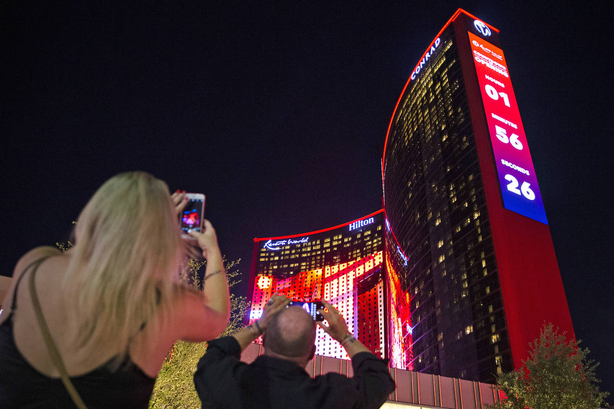 Beth Burdick, left, and Mark Gierth, both of Las Vegas, photograph Resorts World Las Vegas on T ...