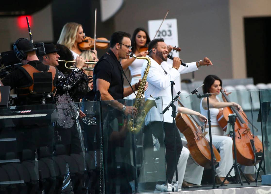 Members of David Perrico's Pop Strings band perform at Allegiant Stadium in Las Vegas on Monday ...