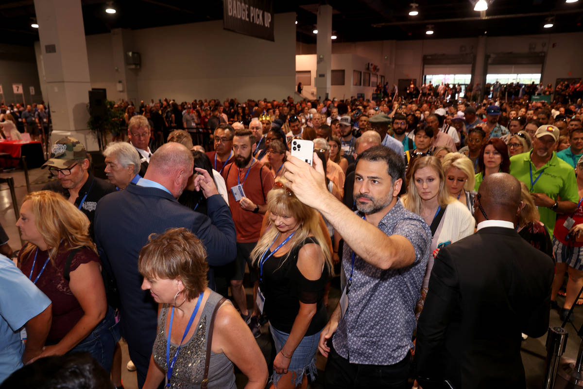 Conventioneers file in as the show floor opens at the Nightclub & Bar Show at the Las Vegas ...