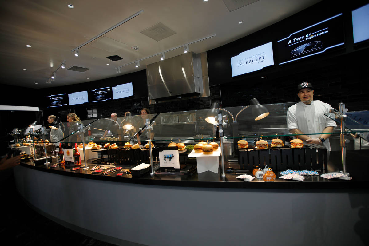 Holsteins chef Thomas Rippe, right, is ready to serve during an event of food and beverage expe ...
