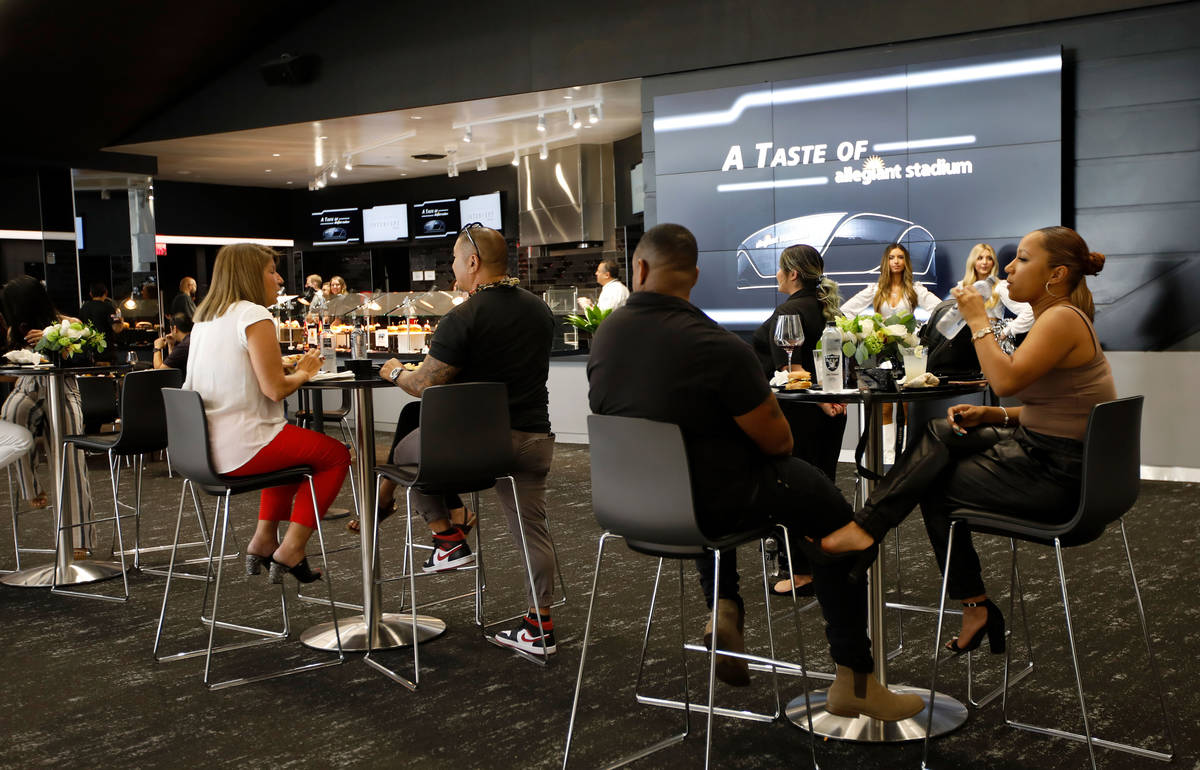 Guests enjoy foods and drinks during an event of food and beverage experience at Allegiant Stad ...