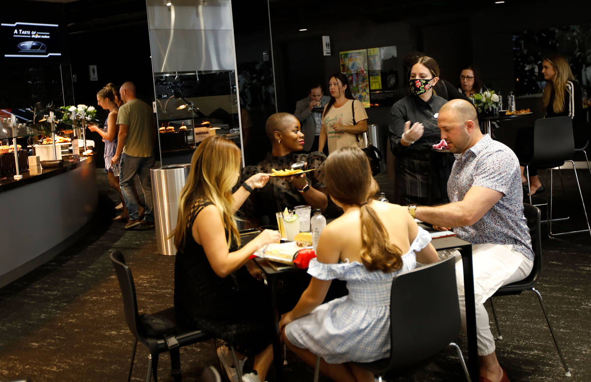 Guests enjoy foods and drinks during an event of food and beverage experience at Allegiant Stad ...