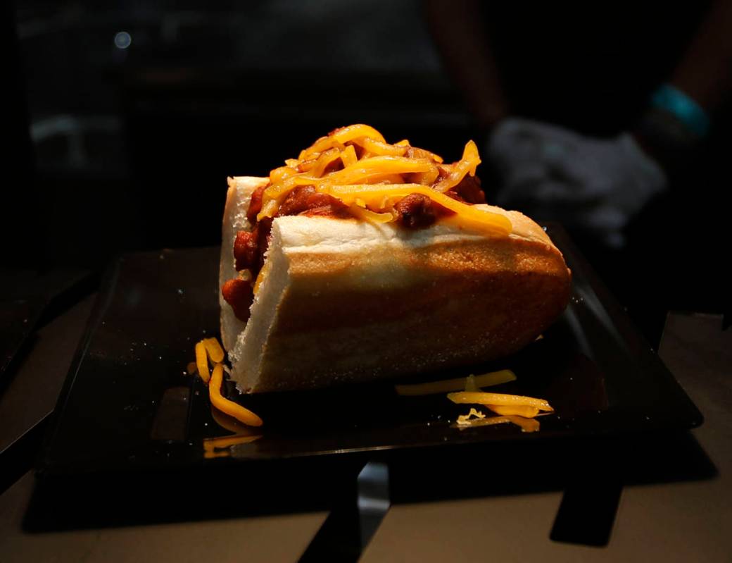 Rollin Smoke Barbecue's brisket chili cheese dogs are served during an event of food and bevera ...