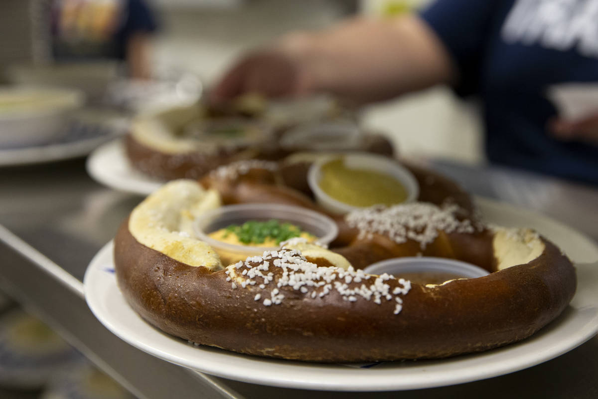 The "Riesenbrezen Combo," a giant pretzel served with Obatzda cheese, sweet mustard a ...