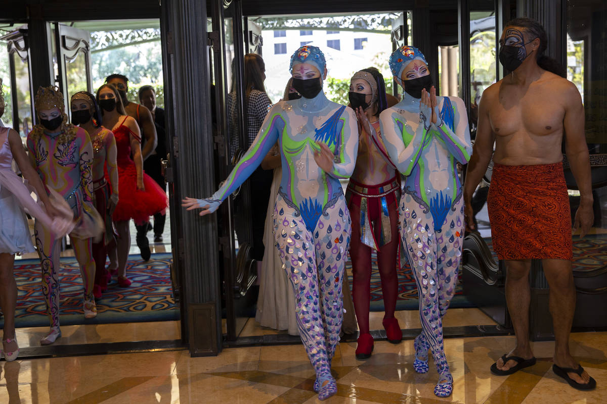 Cast members of "O" arrive for a welcome back parade at Bellagio on Thursday, July 1, ...