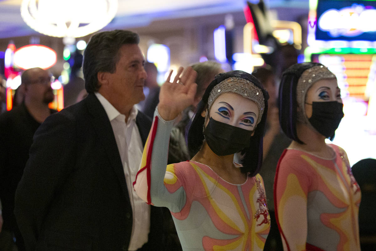 Cast members of "O" walk through Bellagio in a welcome back parade on Thursday, July ...