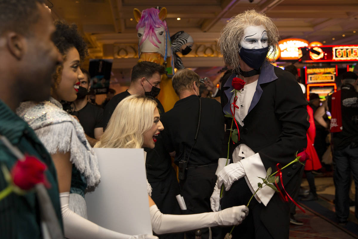 Cast members of "O" walk through Bellagio in a welcome back parade on Thursday, July ...