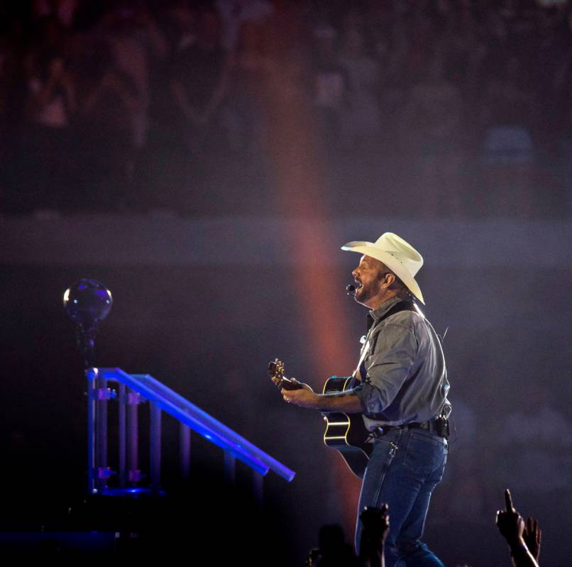 Garth Brooks performs before the crowd at Allegiant Stadium on Friday, July 10 2021, in Las Veg ...
