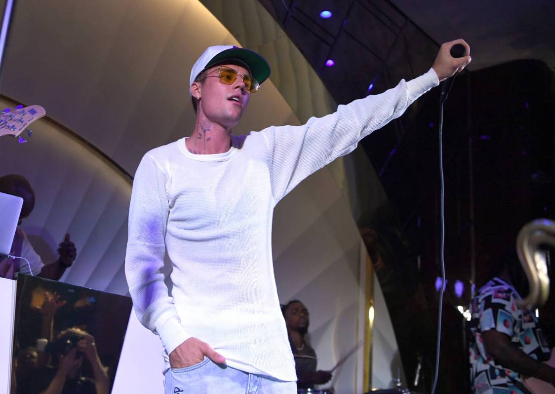 Justin Bieber performs onstage during h.wood Group's grand opening of Delilah at Wynn Las Vega ...