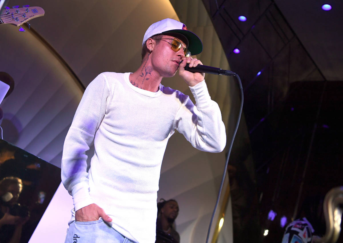 Justin Bieber performs onstage during h.wood Group's grand opening of Delilah at Wynn Las Vega ...