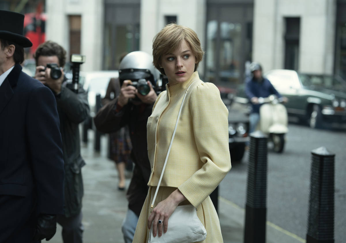 This image released by Netflix shows Emma Corrin in a scene from "The Crown." Corrin ...