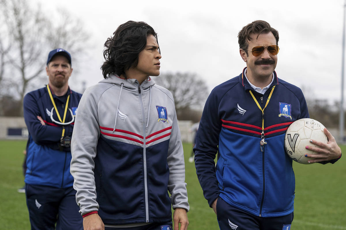 This image released by Apple TV+ shows Brendan Hunt, from left, Cristo Fernández and Jason ...