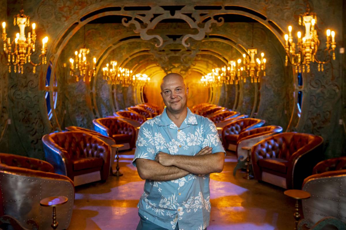 Bryan Davis, founder of Lost Spirits Distillery, poses for a portrait in a tasting room inspire ...