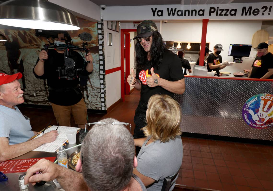 Criss Angel greets, from left, Kenneth Slight, Jeremy Graffam and Bibiana Graffam at his new re ...