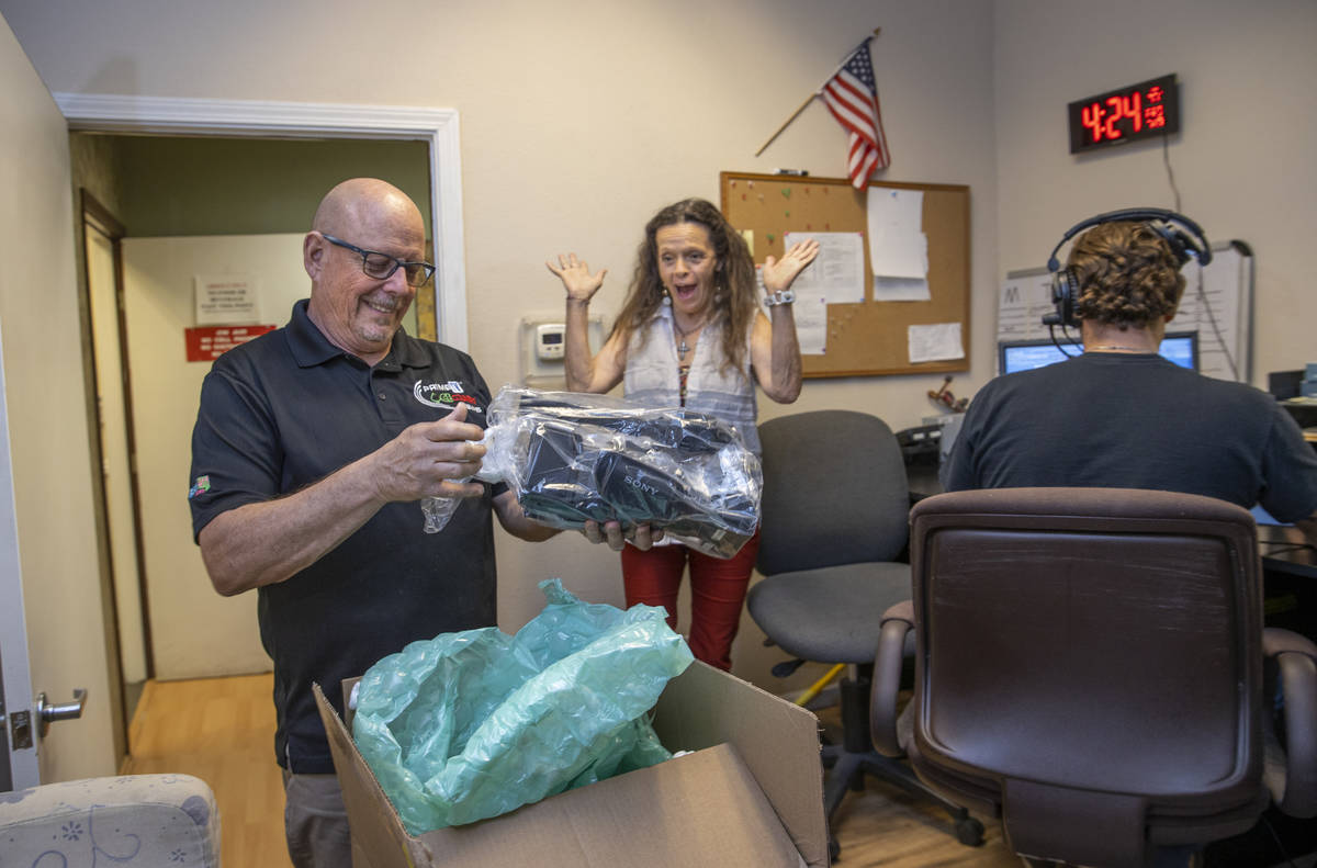 KPVM 25 Co-Owner/President Vern Van Winkle, left, is pleased to get back a repaired video camer ...