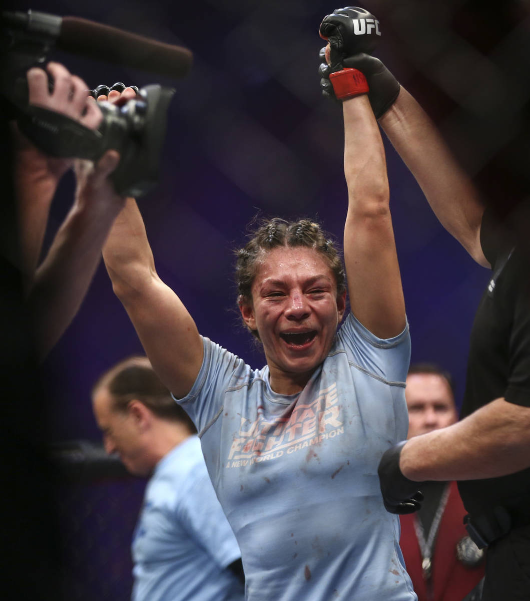 Nicco Montano celebrates after defeating Roxanne Modafferi via unanimous decision in a women's ...