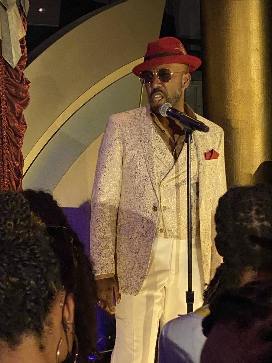 Eric Jordan Young is shown performing at "Backstory Pass," Usher's pre-show immersive productio ...