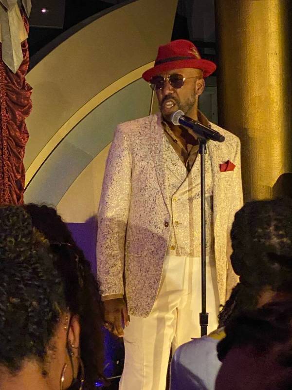 Eric Jordan Young is shown performing at "Backstory Pass," Usher's pre-show immersive productio ...