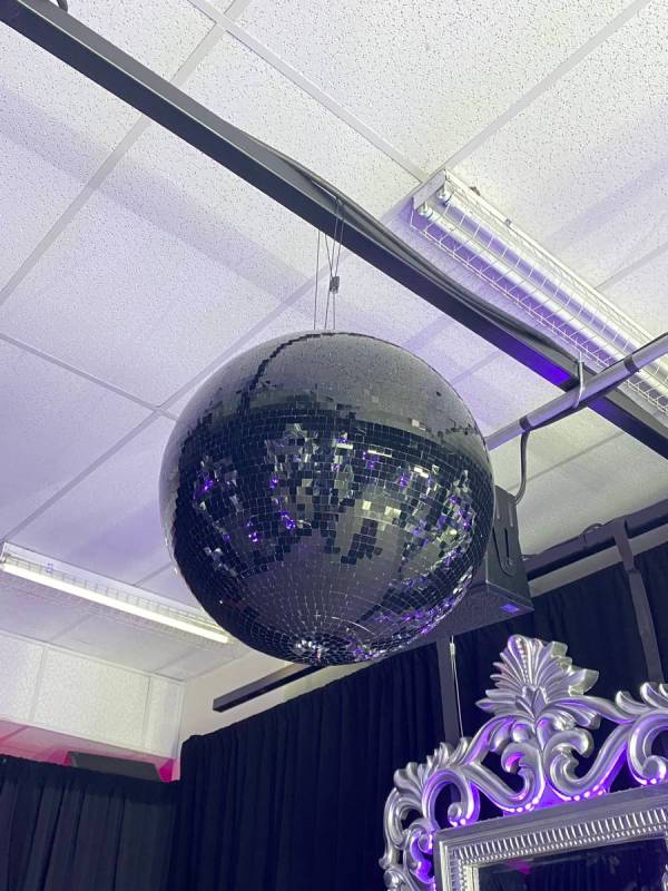 A mirrored ball is shown in The Future Room at "Backstory Pass," Usher's pre-show immersive pro ...