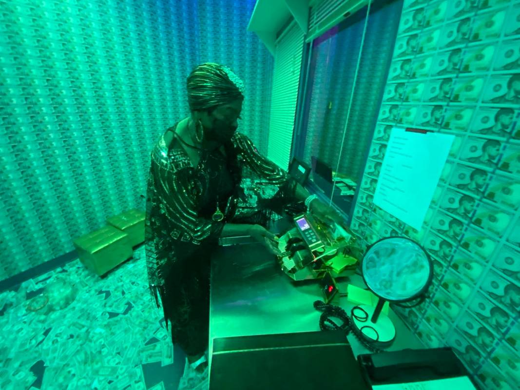 Martha Watson, the Den Mother, is shown in The Counting Room at "Backstory Pass," Usher's pre-s ...