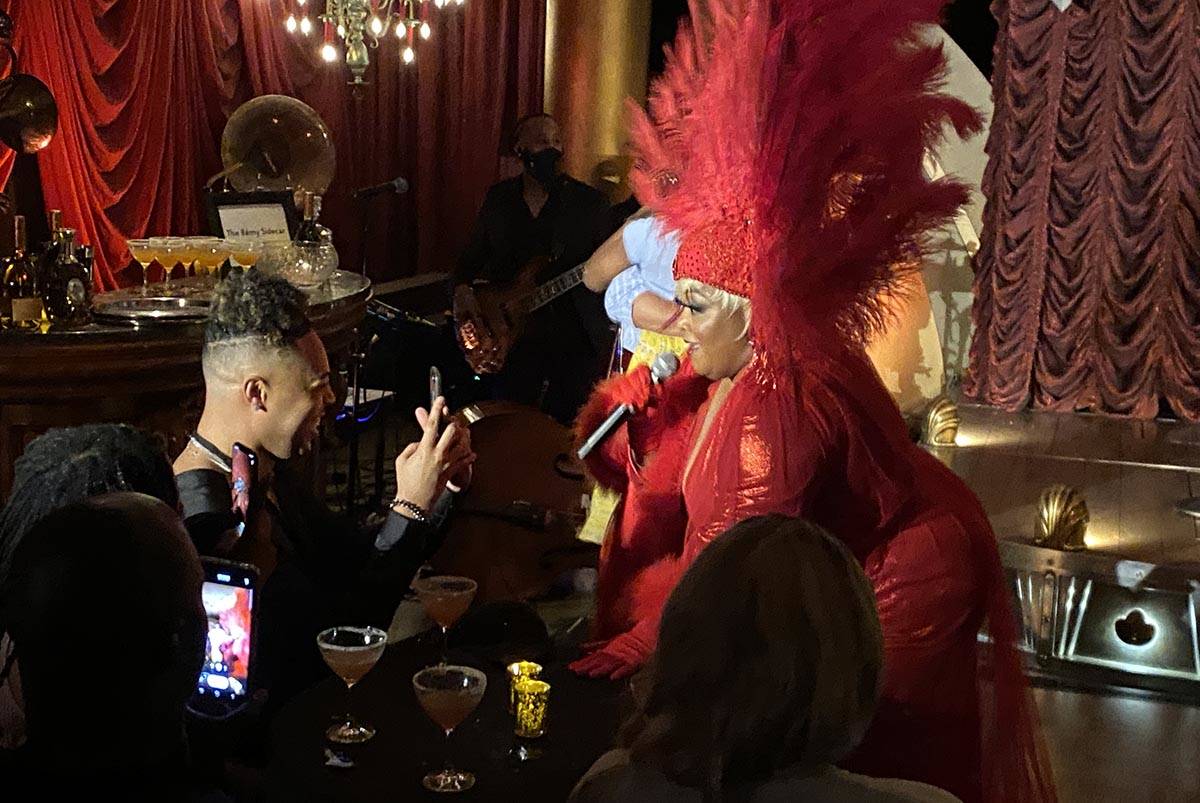 Skye Dee Miles is shown performing at "Backstory Pass," Usher's pre-show immersive production, ...