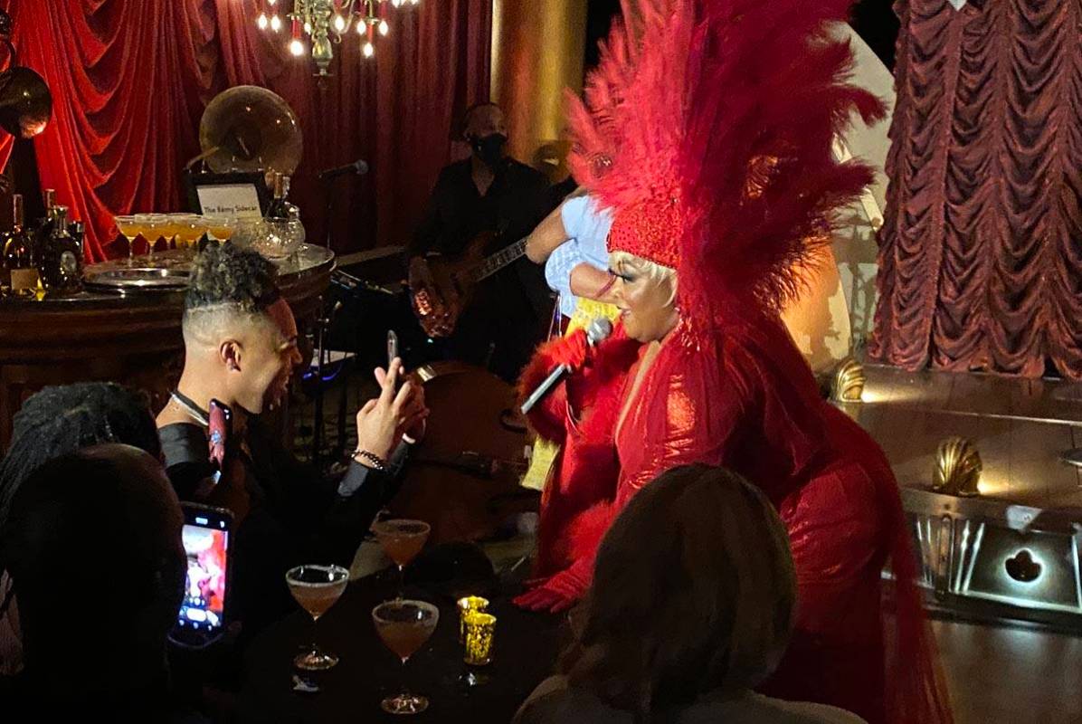 Skye Dee Miles is shown performing at "Backstory Pass," Usher's pre-show immersive production, ...
