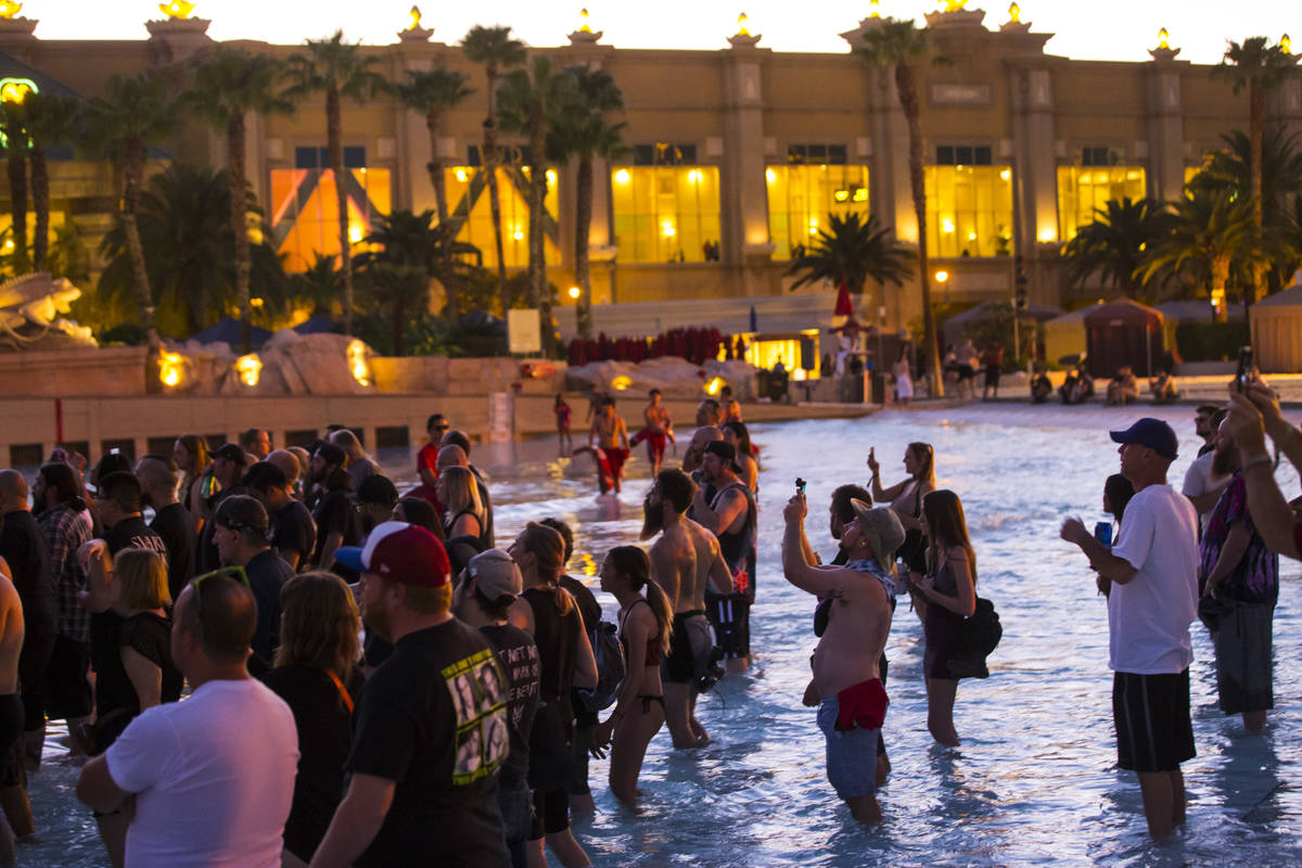 Fans watch as Cold Cave performs at the beach stage during the Psycho Las Vegas music festival ...