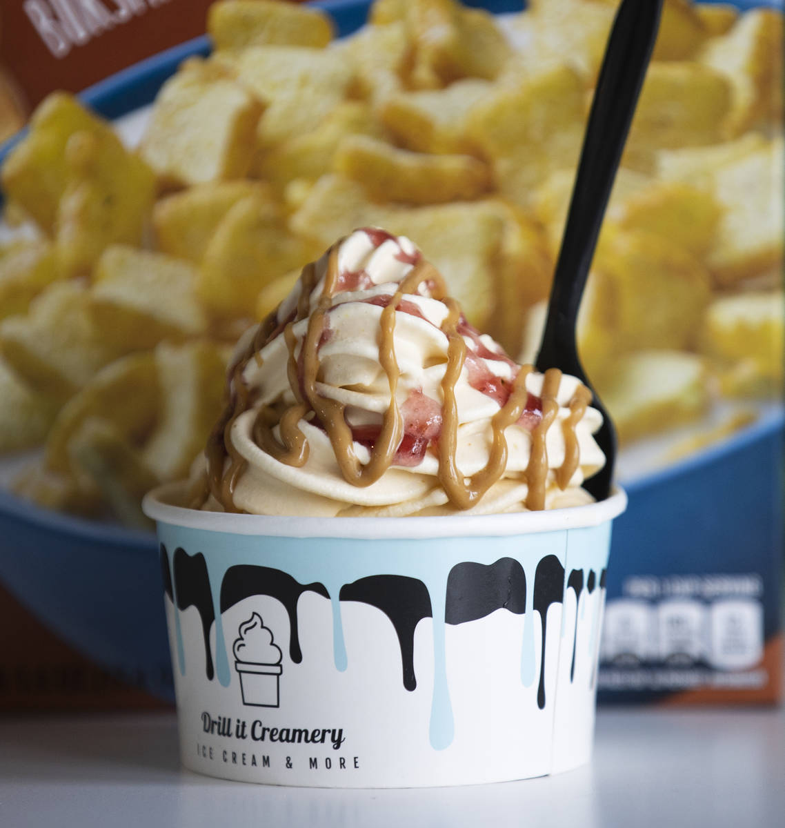 Peanut butter and jelly and strawberry jam drizzle ice cream is displayed at Drill It Creamery ...