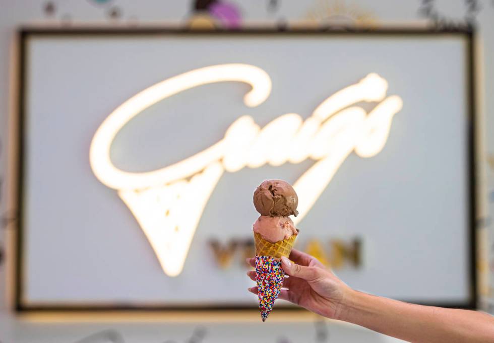 Chocolate and strawberry ice cream in a cone outside of Craig's Vegan ice cream in The District ...