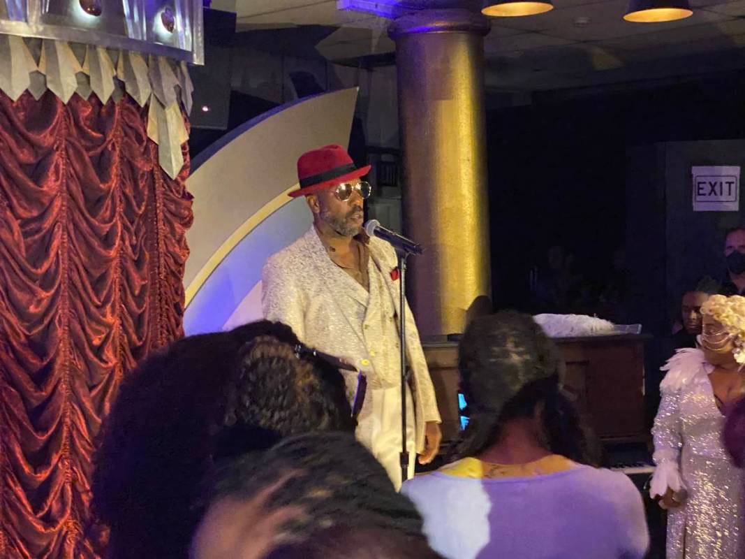 Eric Jordan Young is shown performing at "Backstory Pass," Usher's pre-show immersive productio ...