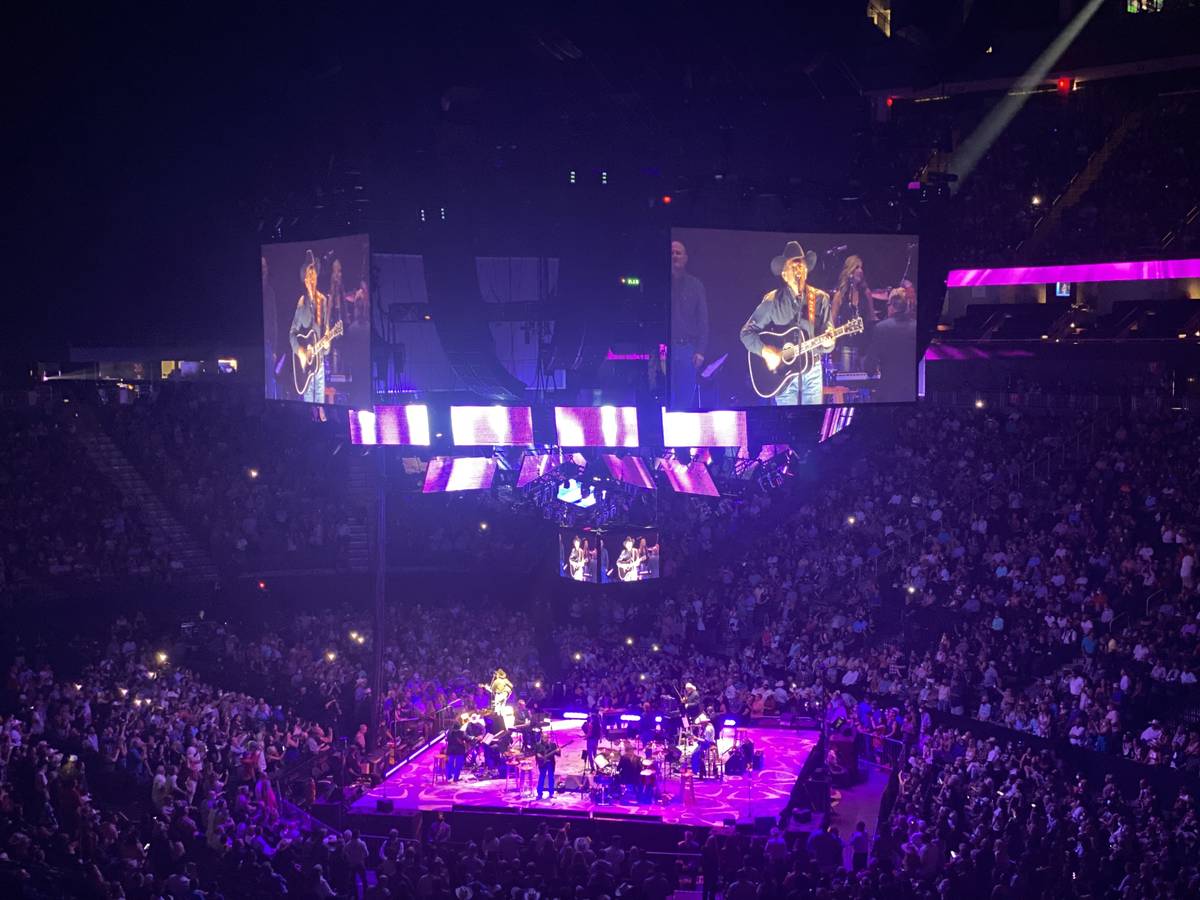 George Strait is shown on the big screen in his return to T-Mobile Arena on Friday, Aug. 13, 20 ...