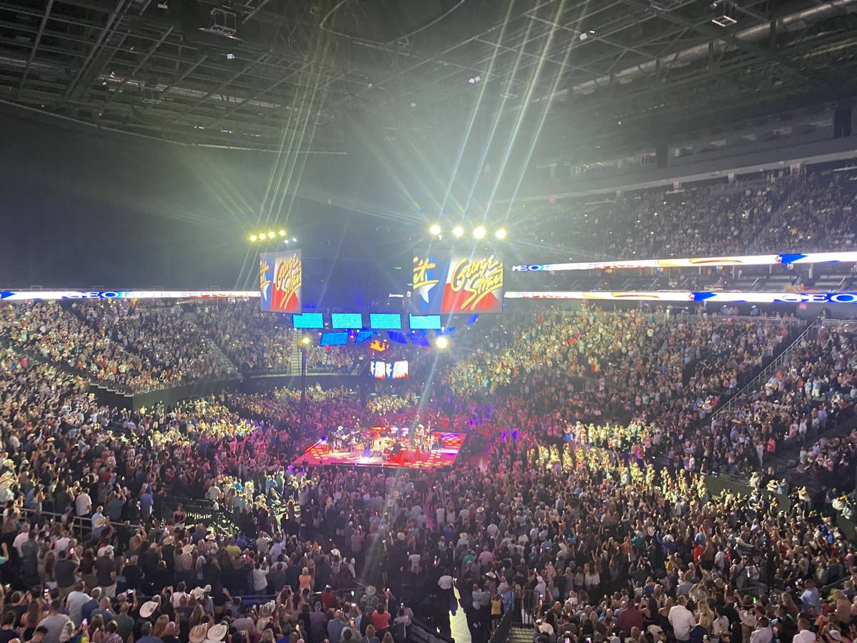 George Strait is shown on the big screen in his return to T-Mobile Arena on Friday, Aug. 13, 20 ...