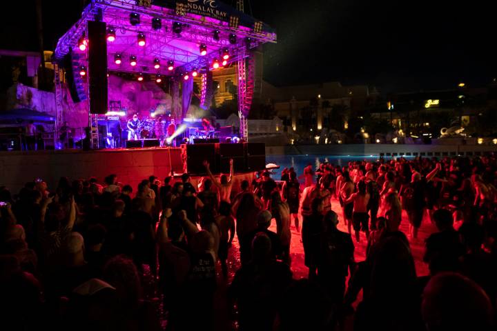 People mosh in the water at the beach stage as Pig Destroyer performs during Psycho Las Vegas a ...