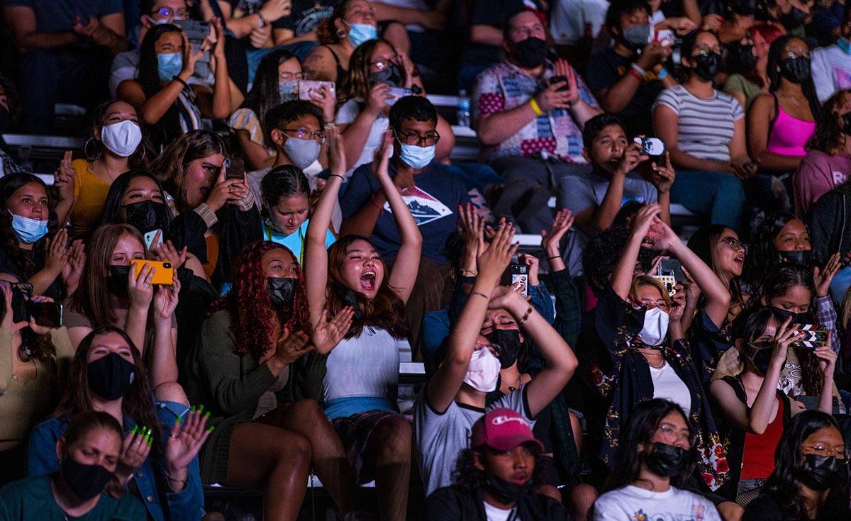 Students dance and sing along as the Imagine Dragons perform at a Walmart-sponsored "Homecoming ...