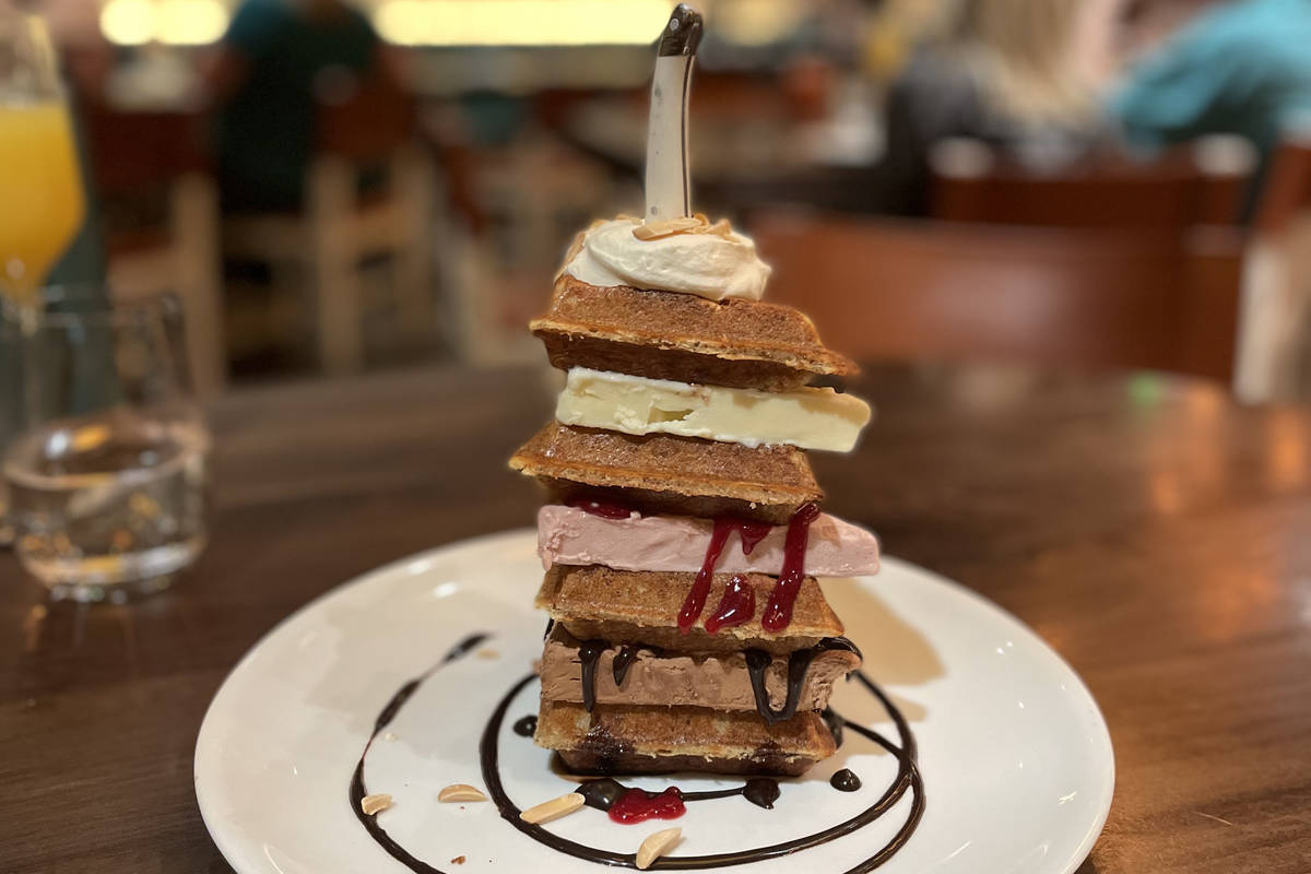 The Anytime Waffle Tower created with maple, milk chocolate and raspberry ice cream, chocolate ...