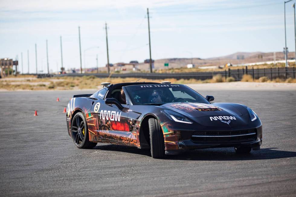 Angel Frechette of Las Vegas drives an Arrow car with Arrow engineer Leah Davidson in the passe ...