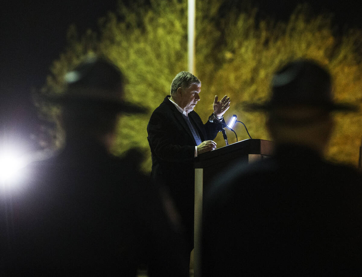 Gary Wadell provides the opening words during a candlelight vigil for victims of traffic accide ...